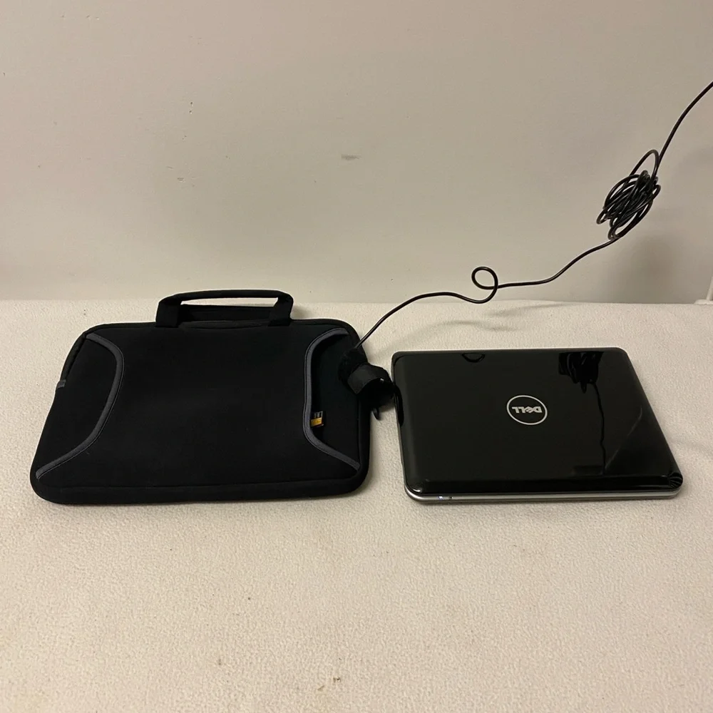 The Dell Inspiron 910, Model PP39S with soft carry case and power cord.